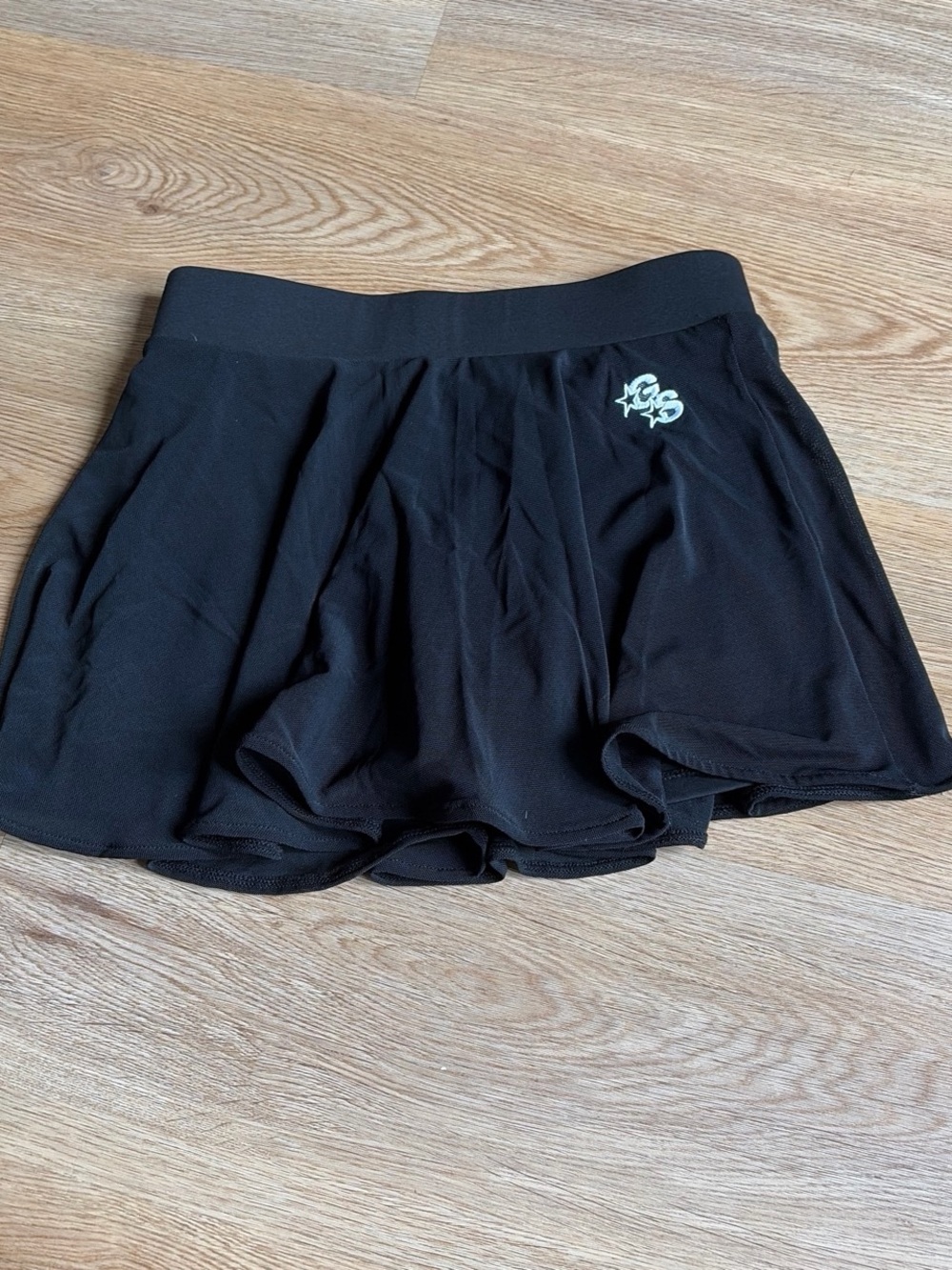 Black Pleated Mini Skirt with Logo Accent